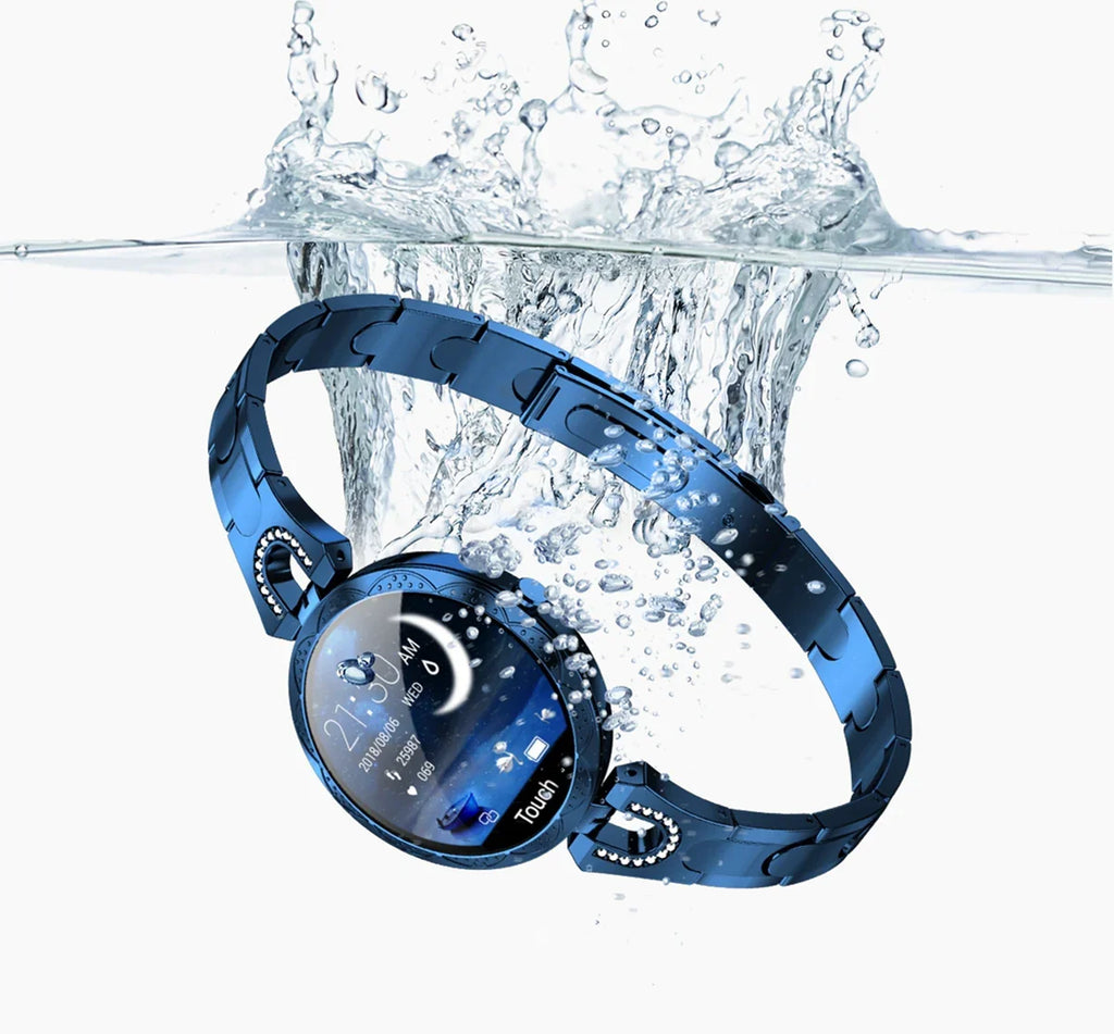 Waterproof blue smart watch with round face and metal band splashing in water