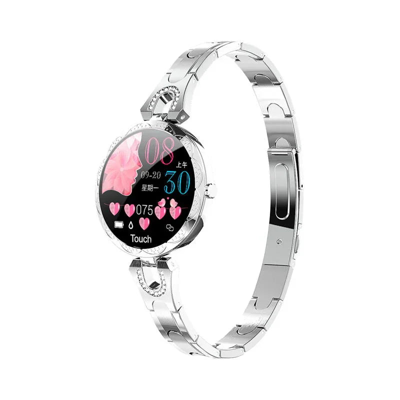 Silver smartwatch with metal band, round touchscreen, digital heart and flower display.
