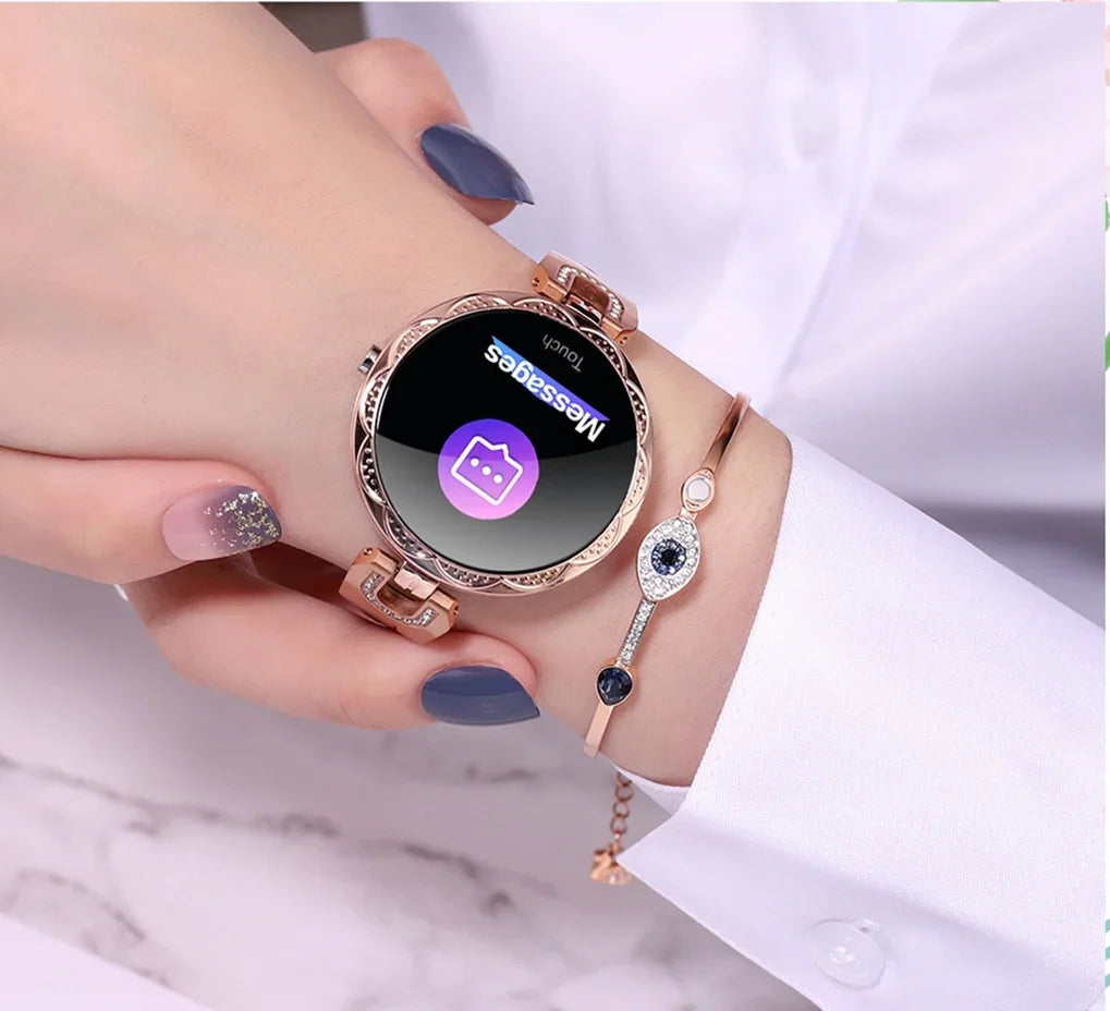 Rose gold smart watch with message notification on woman's wrist, paired with elegant bracelet