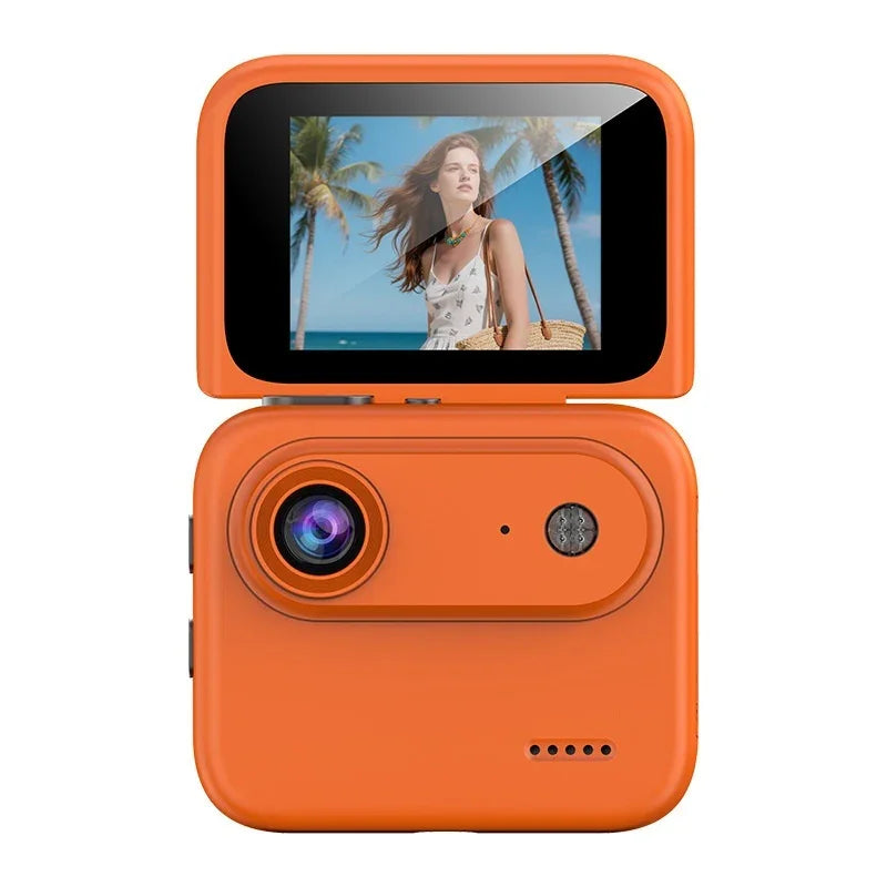 Orange digital camera with flip screen displaying woman at the beach with palm trees