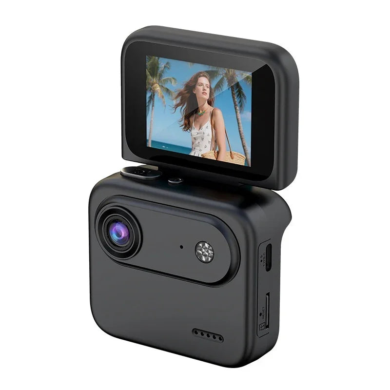 Compact digital camera with flip-up screen displaying woman at the beach, palm trees