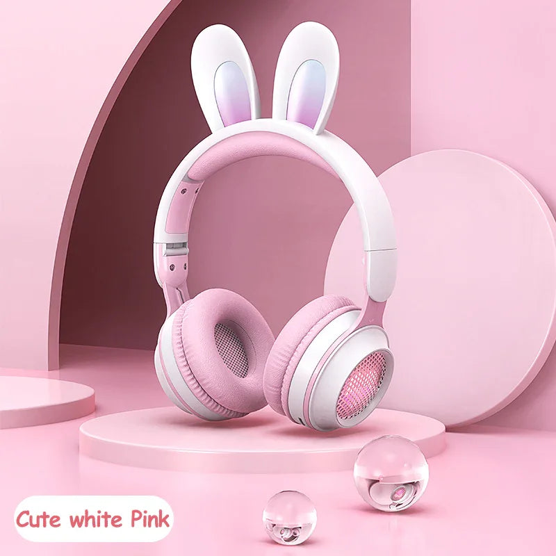 Pink and white bunny ear headphones on pastel pink background, cute aesthetic design