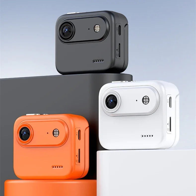 Compact action cameras in black, orange, and white on display blocks, minimalist background